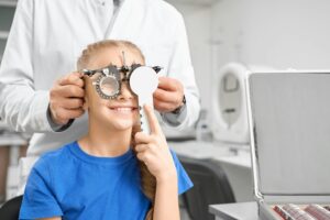 Teenage girl on consultation in ophtalmology clinic